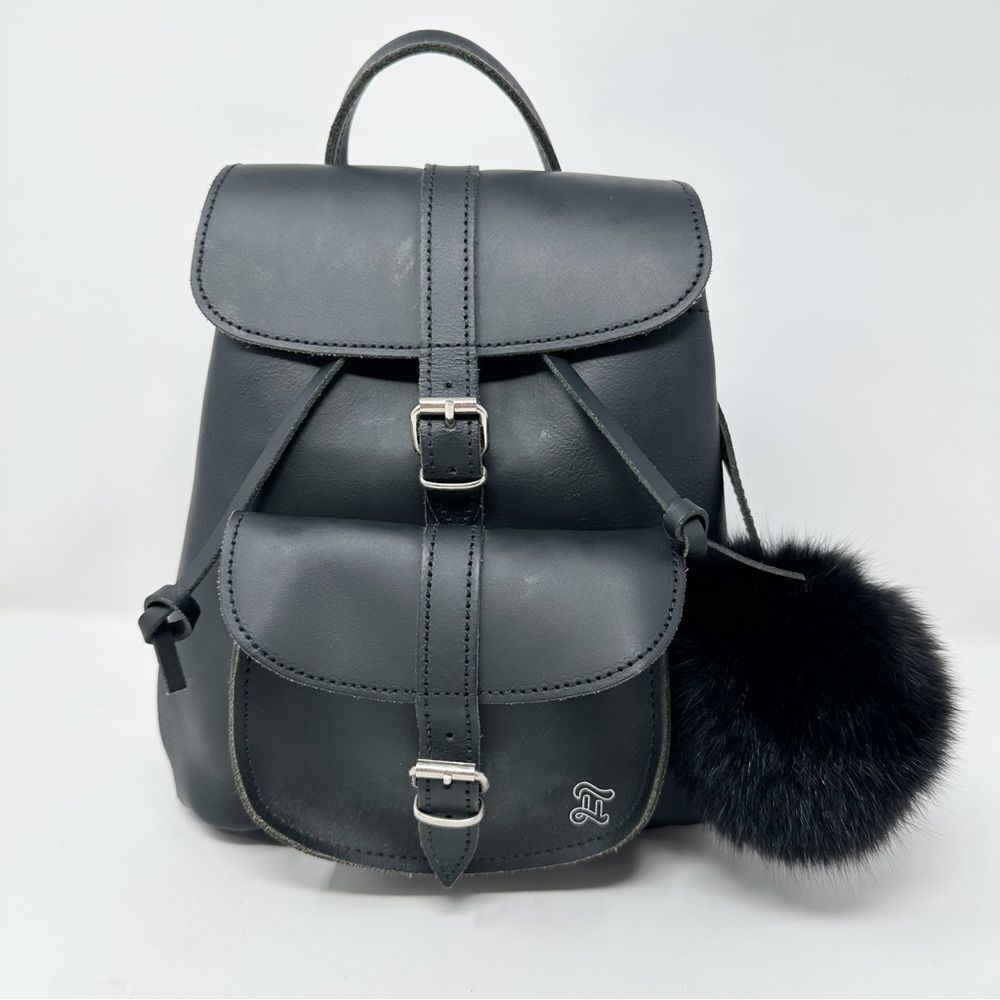GRAFEA DUFFY BLACK LEATHER BACKPACK WITH POM POM